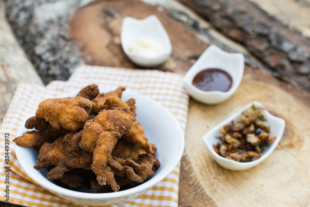 Breaded chicken breast with barbecue sauce and mayonnaise Breaded chicken breast with barbecue sauce and mayonnaise