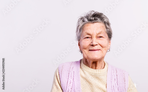 Portrait of a senior woman in studio. Copy space. photo