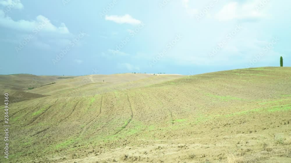 Beautiful view on tuscan plowed fields landscape in Italy Beautiful view on tuscan plowed fields landscape in Italy