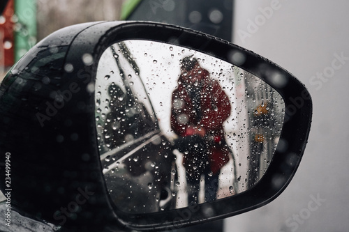 view of the gas station in the rearview mirror. photo