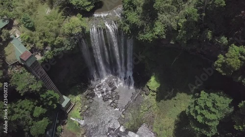 2K Aerial view of Dambri waterfall in Vietnam. Highest and famous waterfall among lush jungle and trees. Top view  photo