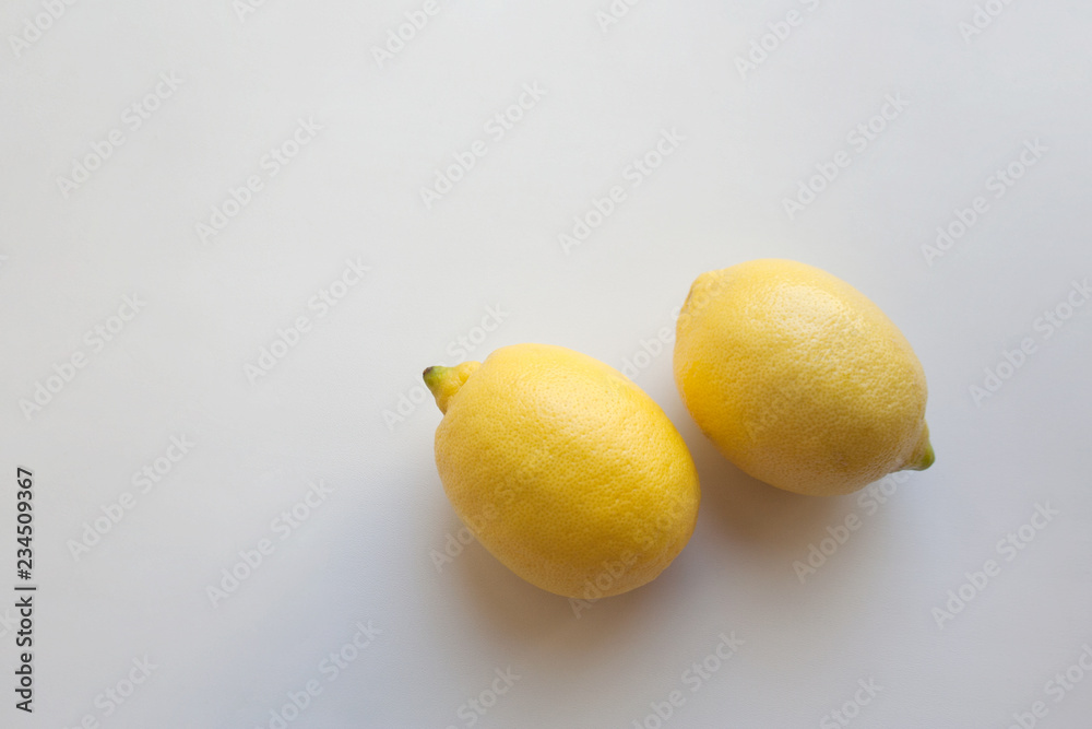 Two ripe lemon fruits isolated on white background with a copy space Two ripe lemon fruits isolated on white background with a copy space
