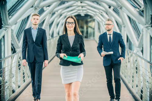 a group of businessmen discussing business plans on the street © de Art