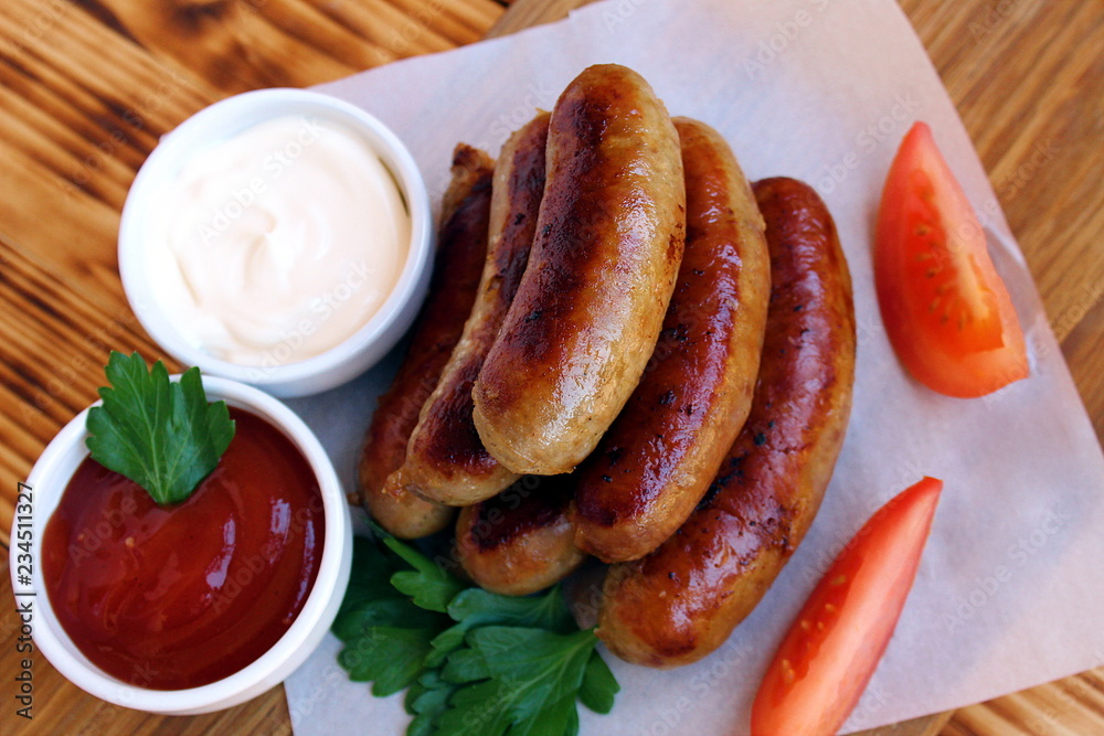 Pan-fried meat sausages with sauce and greens Pan-fried meat sausages with sauce and greens