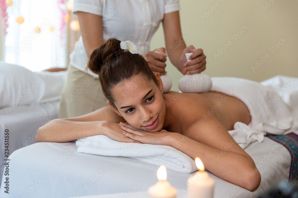Thai massage on woman body in the spa salon. Relaxation and Beauty treatment concept. Thai massage on woman body in the spa salon. Relaxation and Beauty treatment concept.