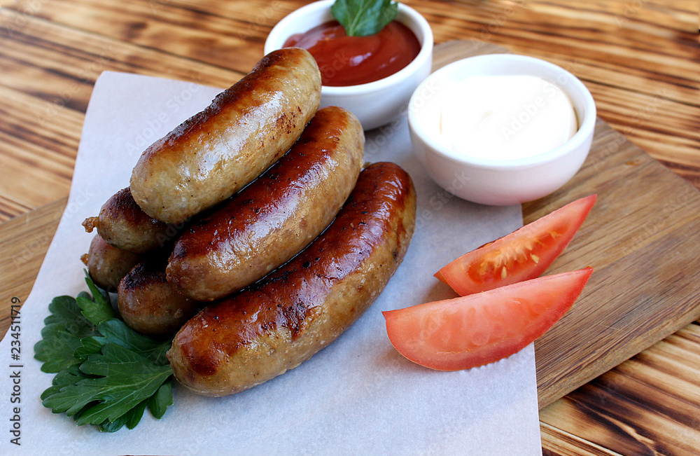 Pan-fried meat sausages with sauce and greens Pan-fried meat sausages with sauce and greens