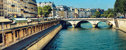 Canvas Print Narrow channel near Notre Dame with bridge Pont Saint-Michel over river Seine in