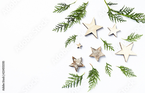 An arrangement of evergreen twigs and Christmas decorations. Flatlay. Copy space. White background