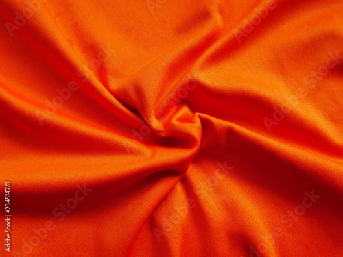 red silk background,orange sportswear clothing,fabric cloth