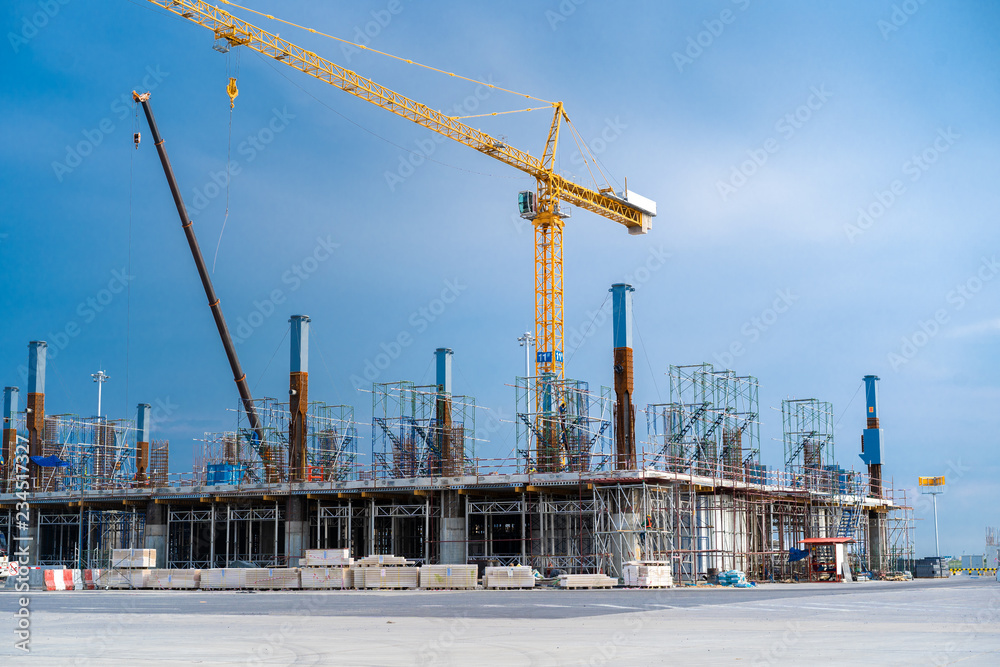 Construction Laborers working on modern construction site. Construction Laborers working on modern construction site.