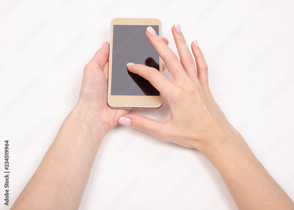 Mobile phone smartphone in hand on a white background isolation top view Mobile phone smartphone in hand on a white background isolation top view