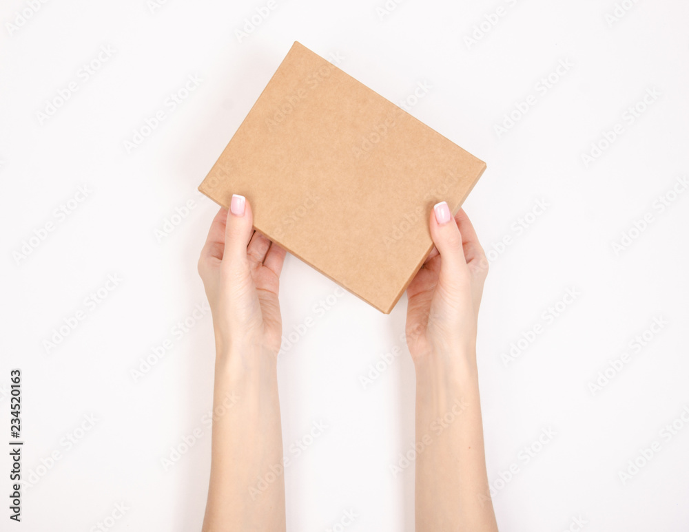Box in hand. Isolation top view on white background. Box in hand. Isolation top view on white background.