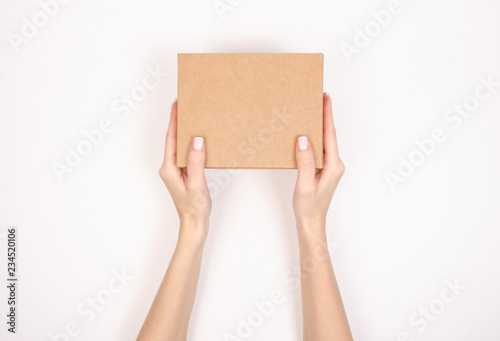 Box in hand. Isolation top view on white background. © Kabardins photo