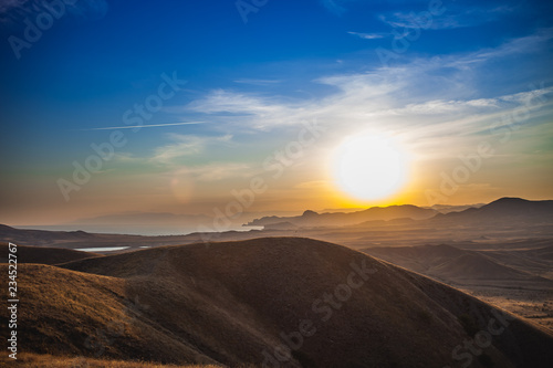 Crimean mountains on the background of the setting sun