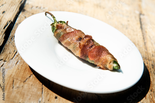 Grilled Pepper stuffed and covered with bacon