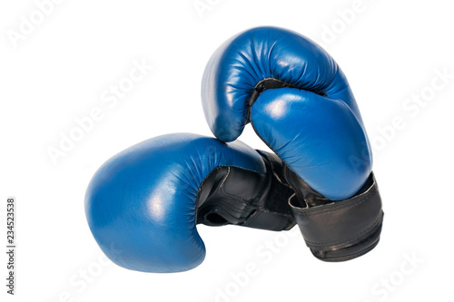 Boxing gloves lie on one side on a white background. Isolated