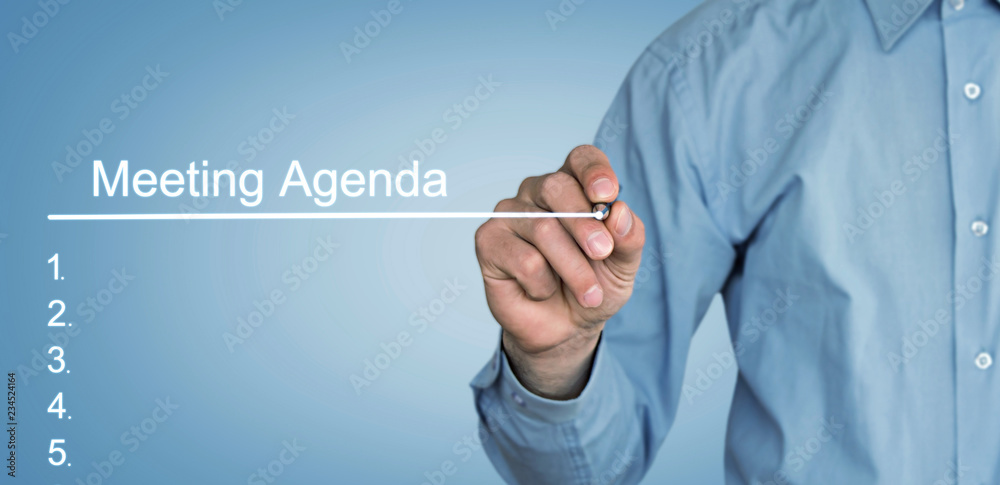 Fototapeta premium Businessman writing Meeting Agenda in screen.