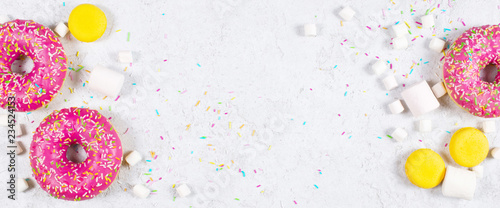 Light banner with donuts, macarons and marshmallow