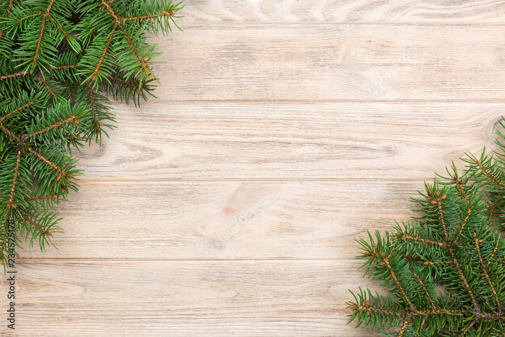 Christmas gray wooden background with fir tree and copy space. top view empty space for your design Christmas gray wooden background with fir tree and copy space. top view empty space for your design