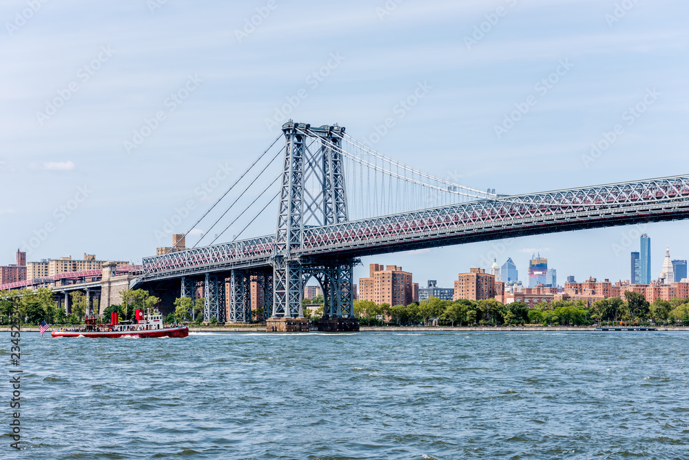 The Williamsburg Bridge Crossing Over New York City's East River Into Manhattan