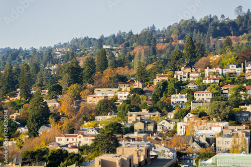 Aerial view of residential neighborhood built on a hill on a sunny autumn day, Berkeley, San Francisco bay, California; photo