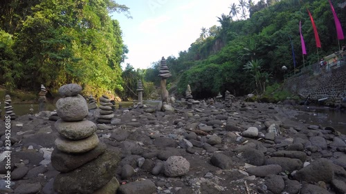 cairn at a waterfall in Indonesia