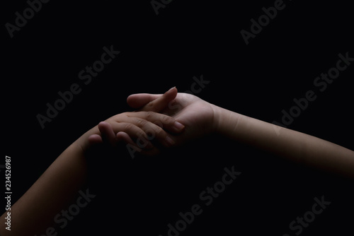 Close up of children hand holding together. Lovers couple holding hands. friendship concept (Soft focus with film grain)