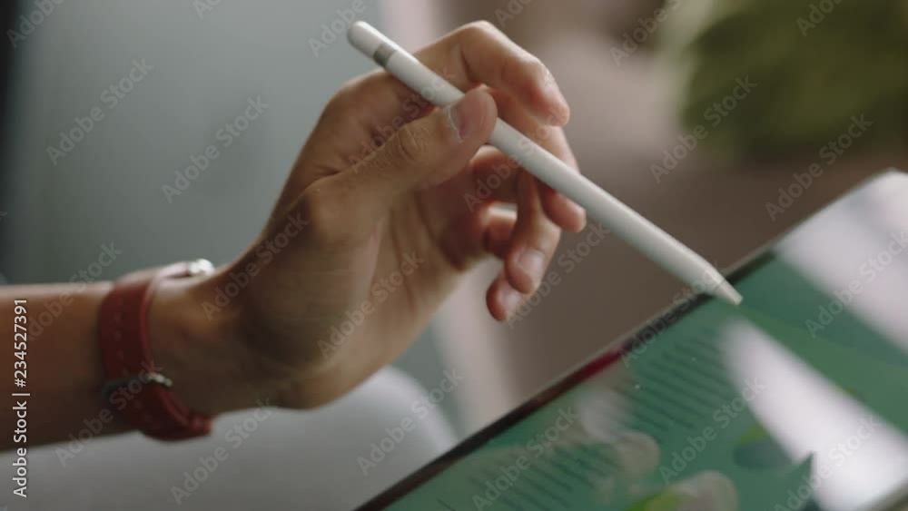 close up hands businessman using digital tablet computer browsing project document on screen reading information planning solution in office meeting