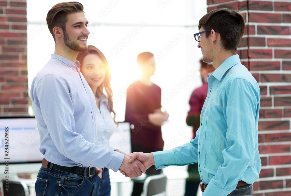 Businesspeople shaking hands before meeting In boardroom. Businesspeople shaking hands before meeting In boardroom.