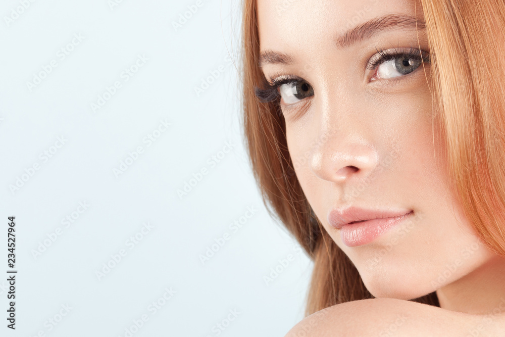 Naklejka premium Young beautiful girl with clean perfect skin close-up