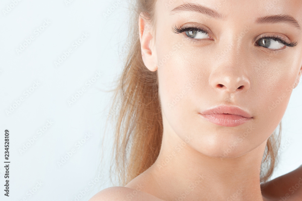 Young beautiful girl with clean perfect skin close-up Young beautiful girl with clean perfect skin close-up
