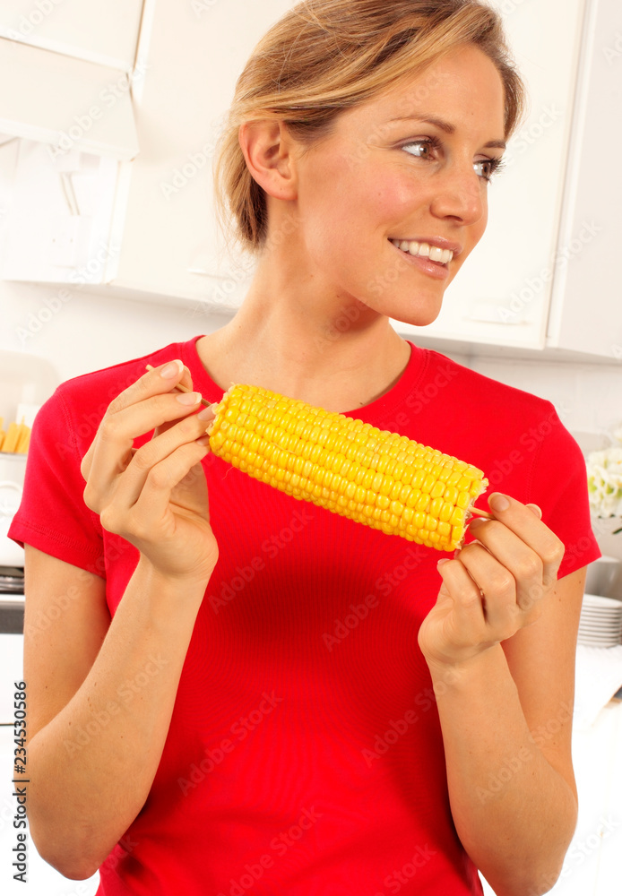 GIRL EATING SWEETCORN GIRL EATING SWEETCORN