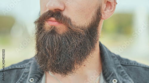 Close-up of the beard of a brutal man.