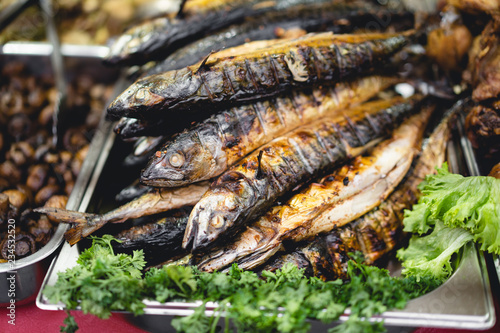 delicious food baked fish with salad