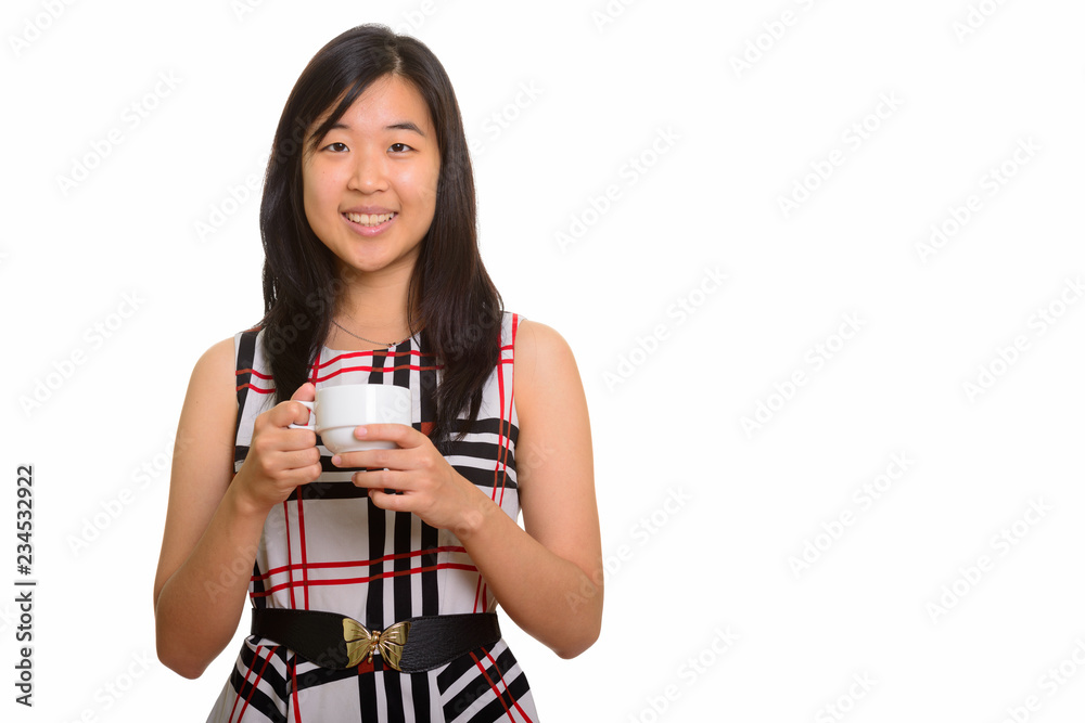 Young happy Asian businesswoman holding coffee cup Young happy Asian businesswoman holding coffee cup
