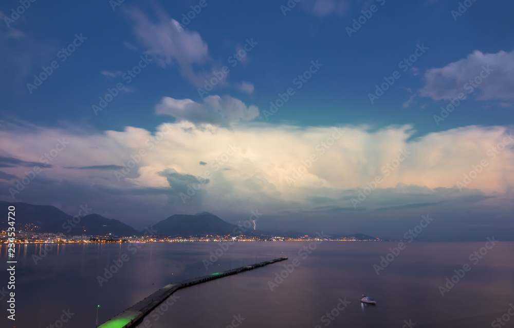 Alanya city harbor panorama in the evening with lighting
