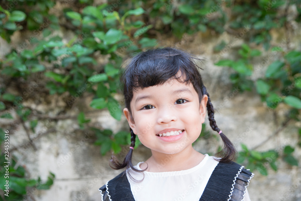 Happy Asian cute girl or kid smiling with happiness. face expression concept. Happy Asian cute girl or kid smiling with happiness. face expression concept.