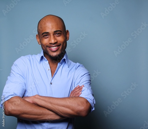 Black man in front of a colored background