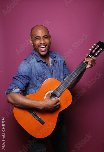 Black man in front of a colored background