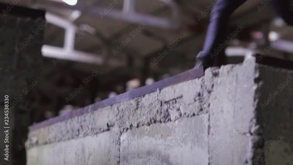 Legs of young woman wearing black leather clothes. Girl jumping. Old plant out of town. Without face. Indoors. Legs of young woman wearing black leather clothes. Girl jumping. Old plant out of town. Without face. Indoors.