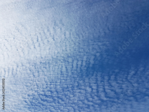 Cirrus clouds on a clear blue sky. Weather forecast. Water in a gaseous state in nature. The atmosphere of the earth. The effect of humidity on agricultural production. The symbol of freedom