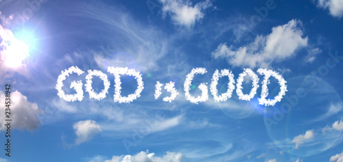 Obraz na płótnie Painted clouds on a blue background with a flare of the sun and white clouds GOD is GOOD inscription w salonie