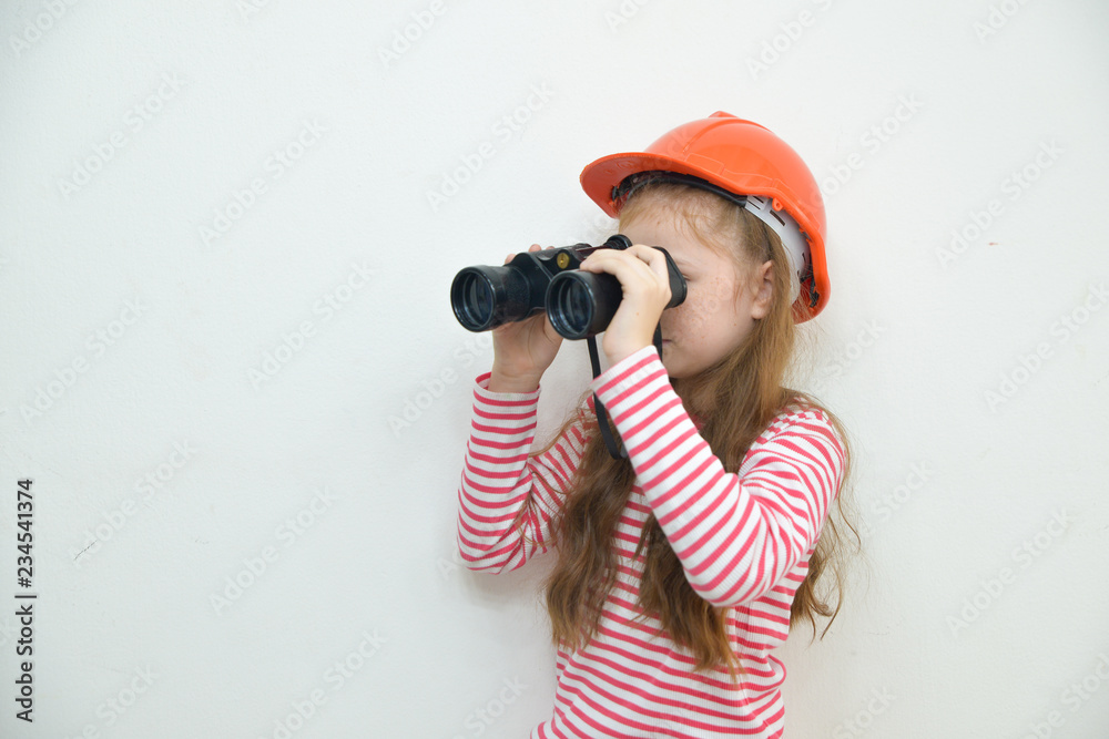 American happy child girl playing with binoculars and looking ahead. future,and freedom concept. American happy child girl playing with binoculars and looking ahead. future,and freedom concept.