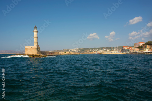 Venetian Harbor and lighthouse of Chania Old Town. Crete island of Greece © axynia
