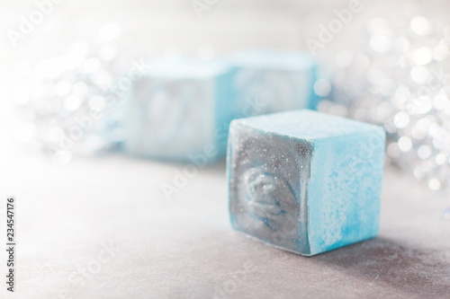 Fototapeta Naklejka Na Ścianę i Meble -  Handmade soap in the form of snowflakes, natural cosmetics concept. Place for text.