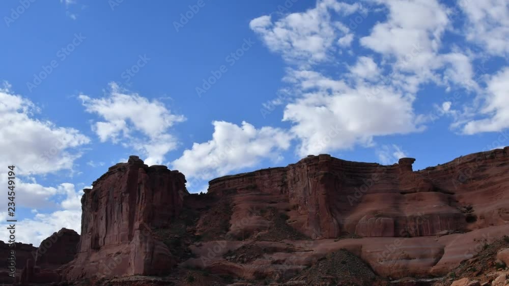 Time Lapse at Arches national Park, Utah. Clouds moving toward camera. Camera panning left to right. Time Lapse at Arches national Park, Utah. Clouds moving toward camera. Camera panning left to right.
