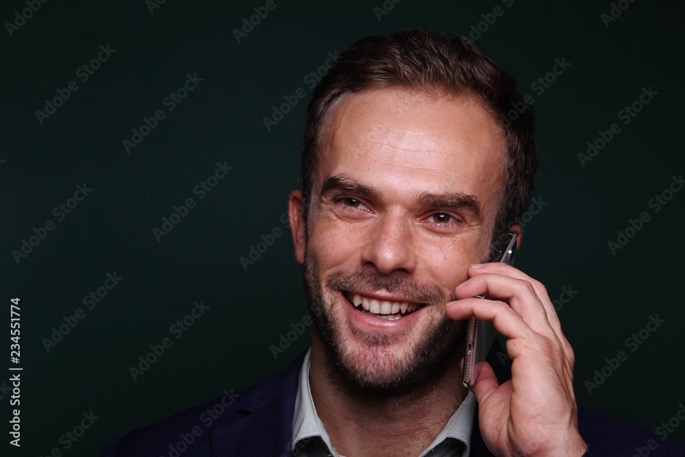 Young man in front of a colored background Young man in front of a colored background