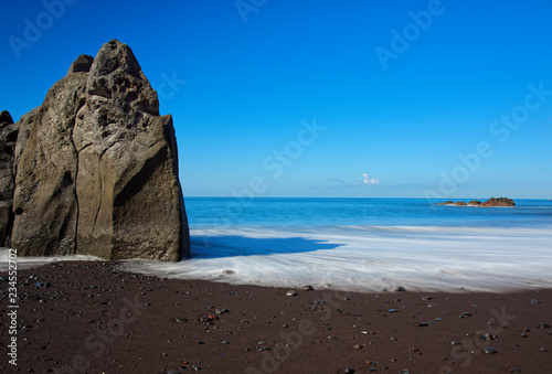 Black sand beach Praia Formosa on Portuguese island of Madeira