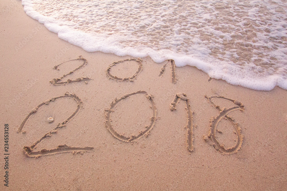 Fototapeta premium New Year 2018 is coming concept. Happy New Year 2018 replace 2017 concept on the sea beach .at phuket Thailand