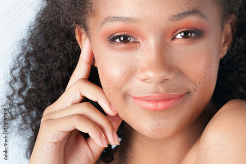 Young beautiful black girl with clean perfect skin close-up